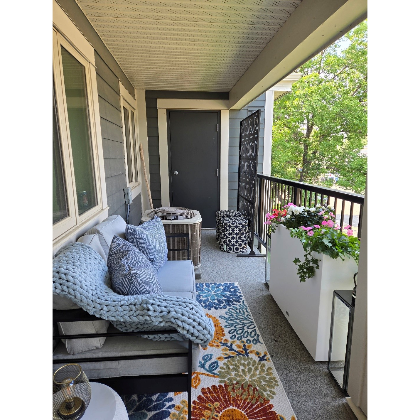 A patio with a chair and a rug

AI-generated content may be incorrect., Picture